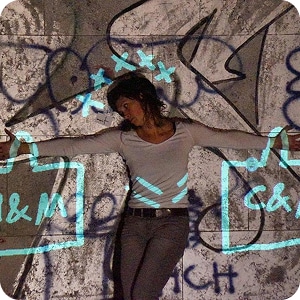 A woman in a white shirt stands against a graffiti-covered wall, arms outstretched. Blue neon doodles of shopping bags and X's evoke the vibrant, creative spirit of events like the Kilkenny Animated Festival.