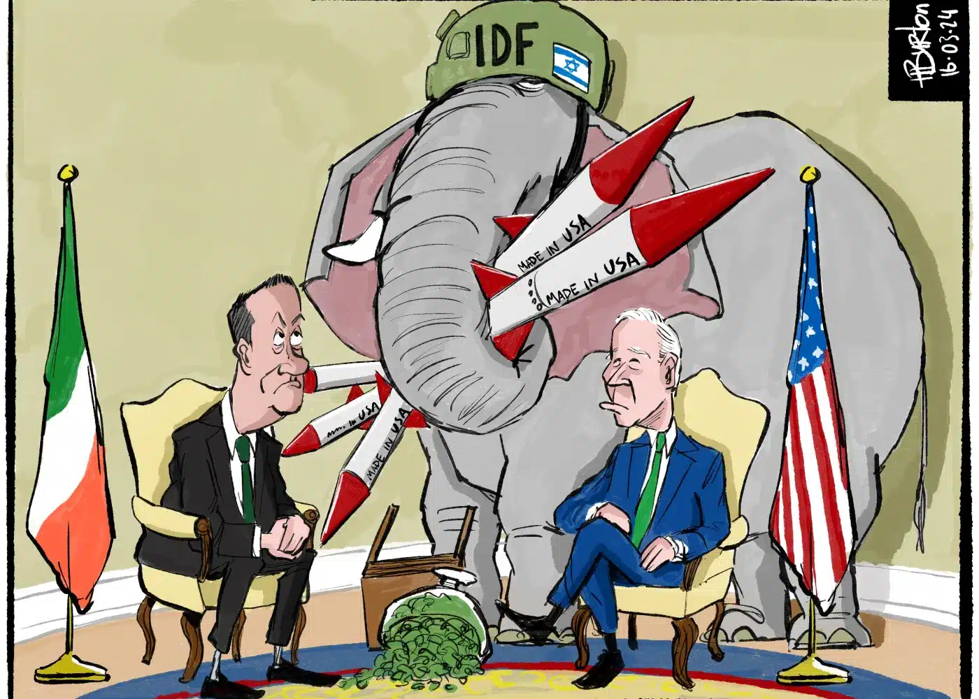 Two men sit between Irish and U.S. flags. An elephant wearing an "IDF" helmet aims U.S.-made missiles at the Irish man. Missiles bear a "Made in USA" label. A trampled shamrock lies on the floor.