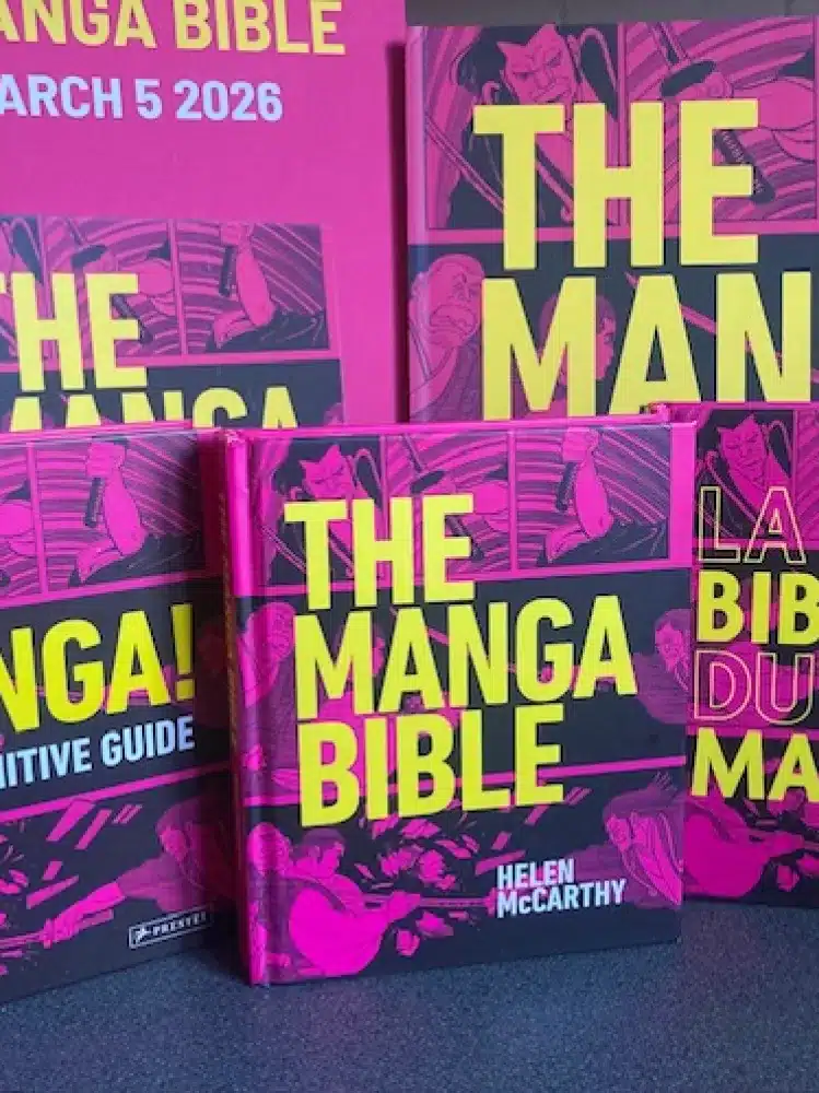 Several copies of "The Manga Bible" by Helen McCarthy are displayed upright and stacked. The covers are bright pink and yellow with bold text and manga-style illustrations in the background.