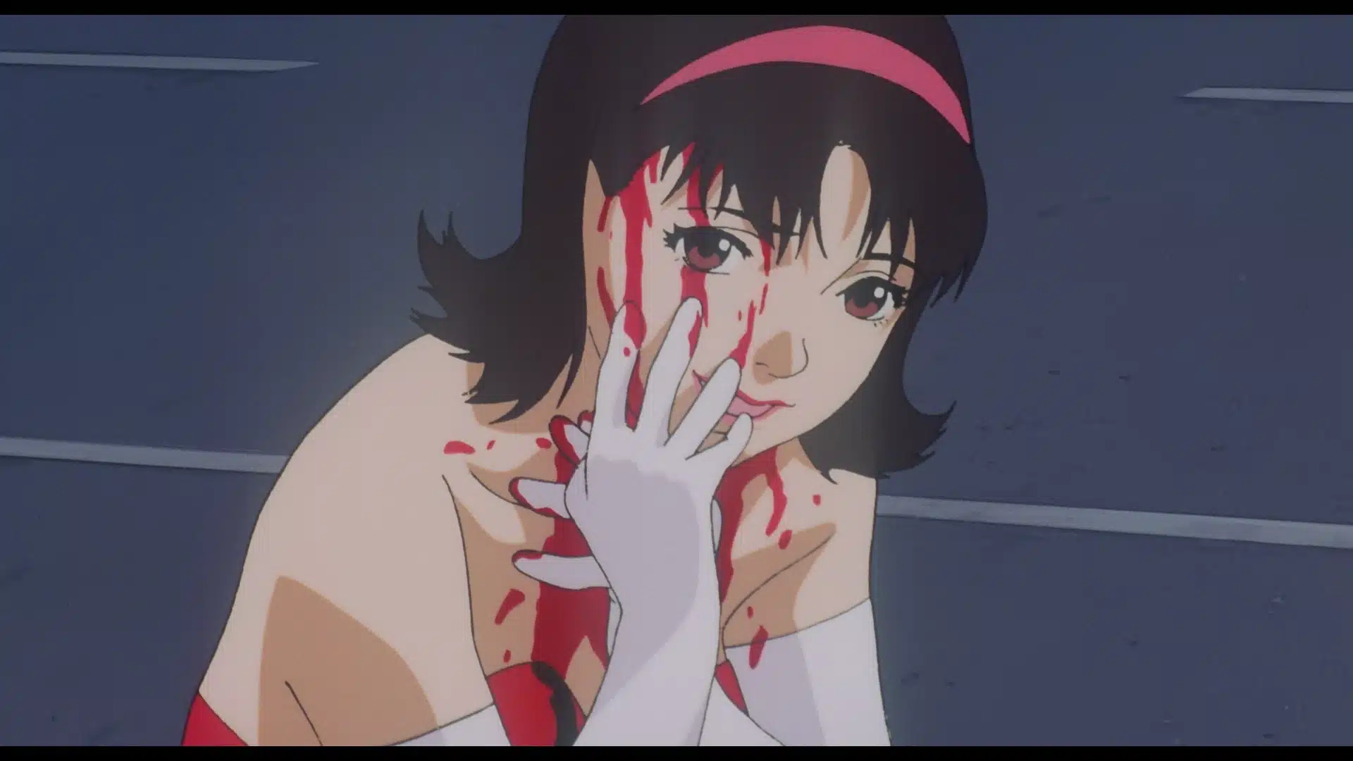 An anime woman with short dark hair and a pink headband sits on the ground, looking ahead. She wears white gloves and a red dress, with blood smeared on her face and hand.