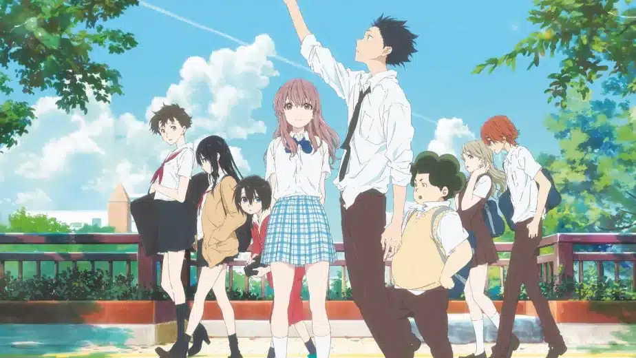A group of seven anime students in school uniforms stand on a sunlit bridge with green trees and a blue sky in the background. One boy reaches upwards while others stand or walk nearby, some looking at the camera.