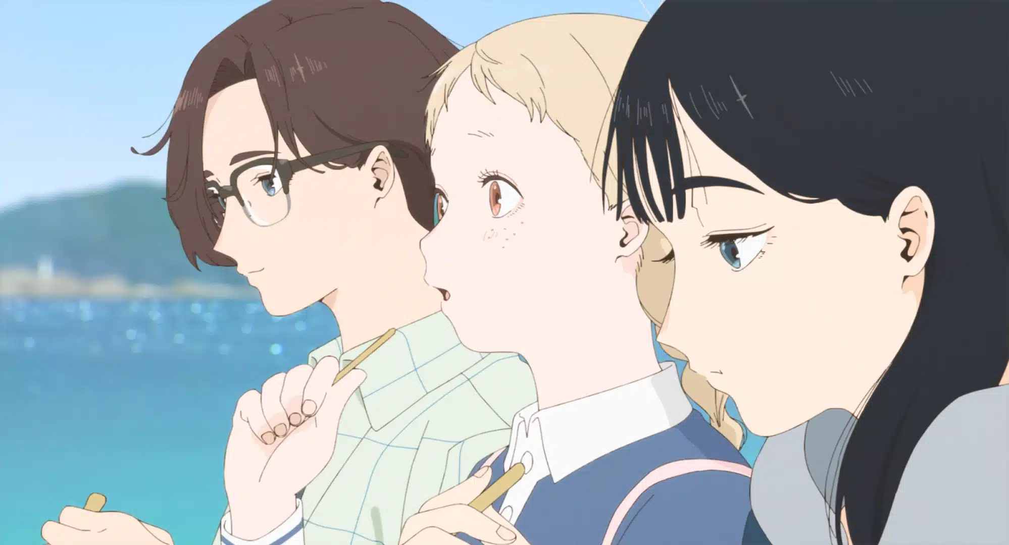 Three animated characters sit close together by the water, eating snacks. The left character has glasses and short brown hair, the middle has blonde hair and freckles, and the right has long black hair. Blue water sparkles in the background.